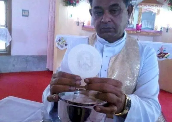 Presiding Priest and the Host